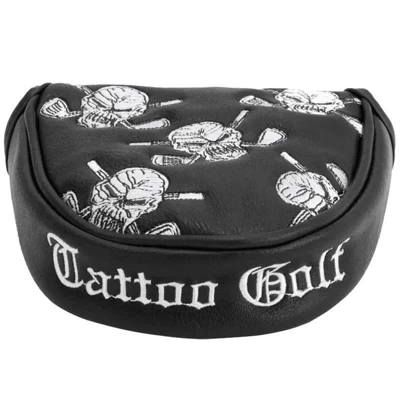 A black and white putter cover with an embroidered skull and crossed golf clubs design, and the text 'Tattoo Golf' on it.
