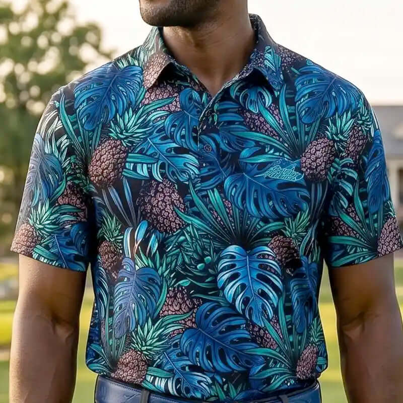 Man wearing a tropical leaf patterned golf polo outdoors
