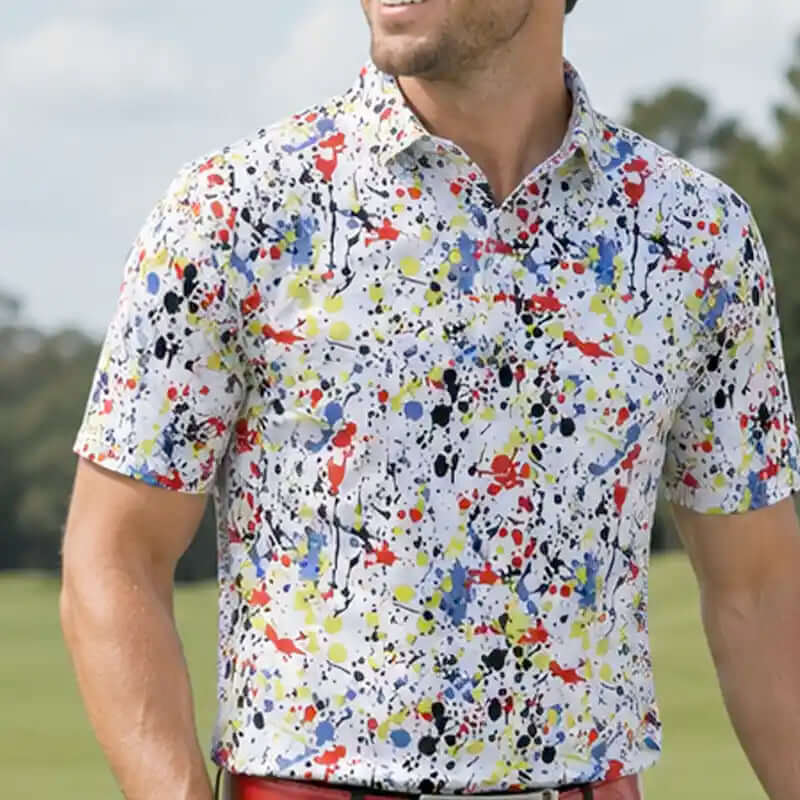 golfer wearing a colorful splatter-patterned shirt on a golf course