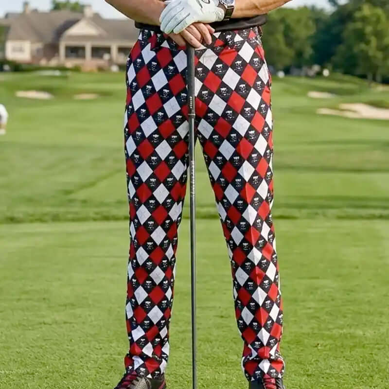 golfer wearing funny red, black, and white checkered pants on a golf course
