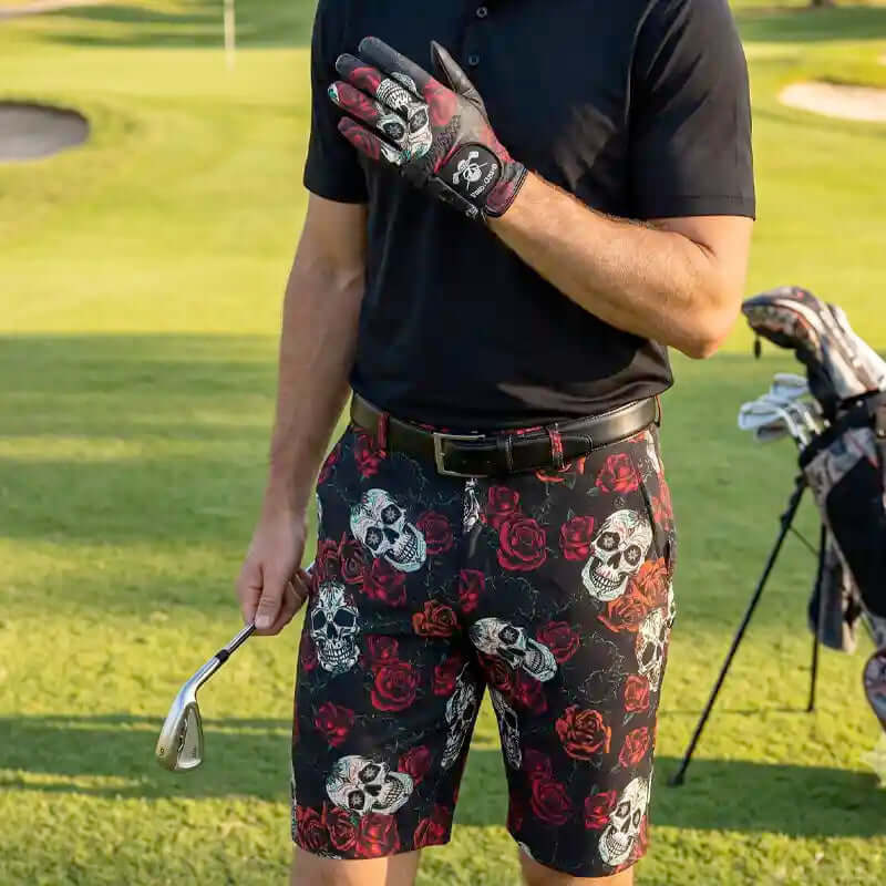 golfer on a golf course wearing skull and rose patterned shorts with golf glove