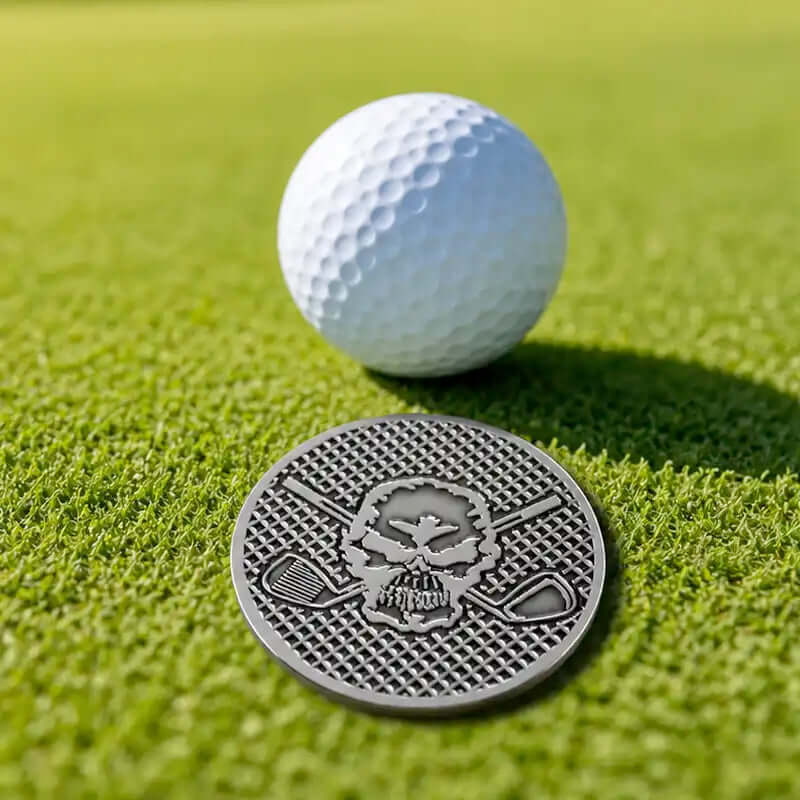 Silver golf ball marker with skull logo by Tattoo Golf