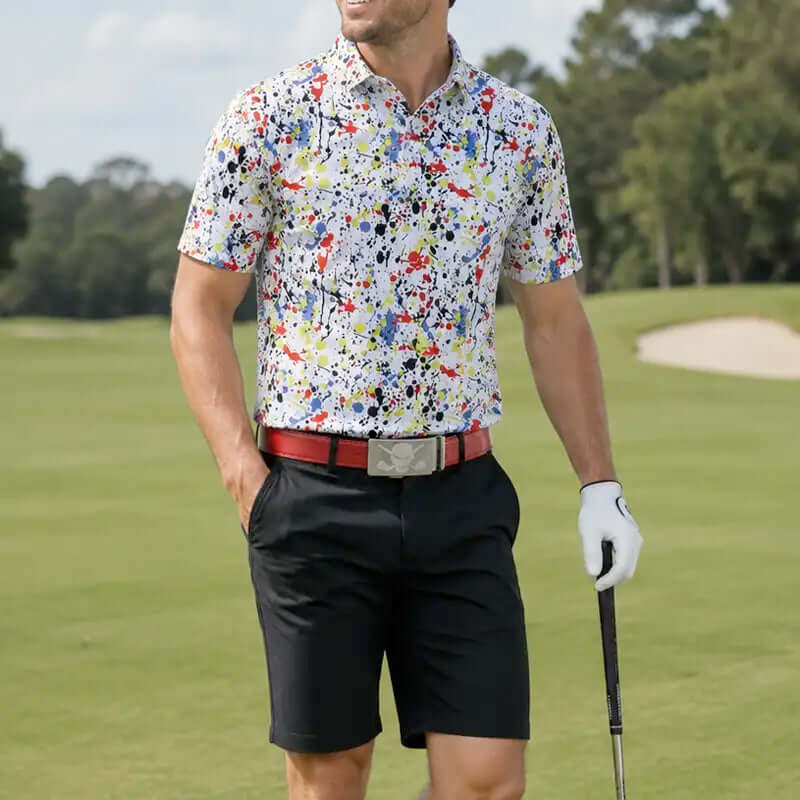 golfer in a colorful shirt and black shorts and red belt on a golf course