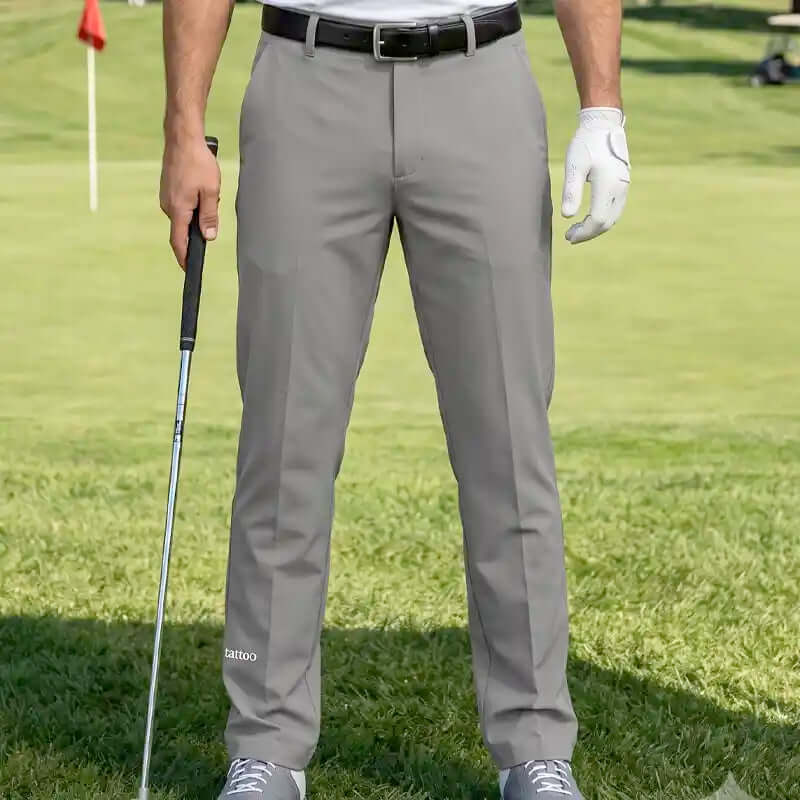 golfer wearing cool gray golf pants on a golf course