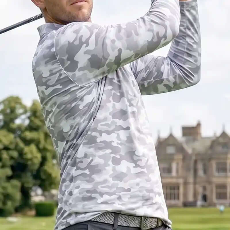 golfer wearing a white camouflage long-sleeve shirt on a golf course