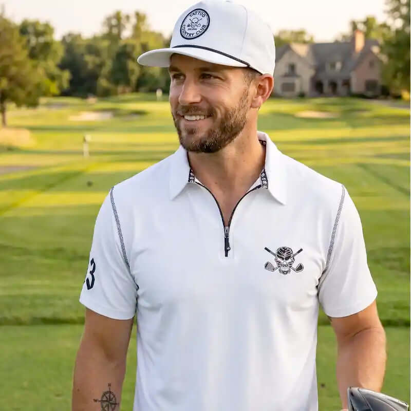 golfer in white golf attire on a golf course