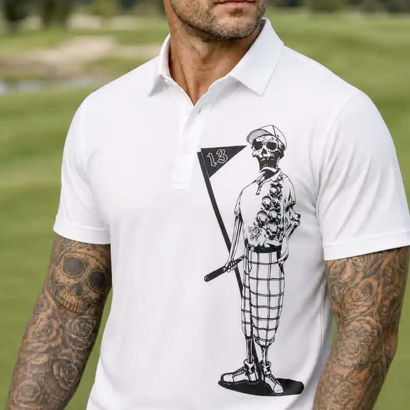 Man wearing Mr. bones white polo shirt with a black and white graphic design outdoors.