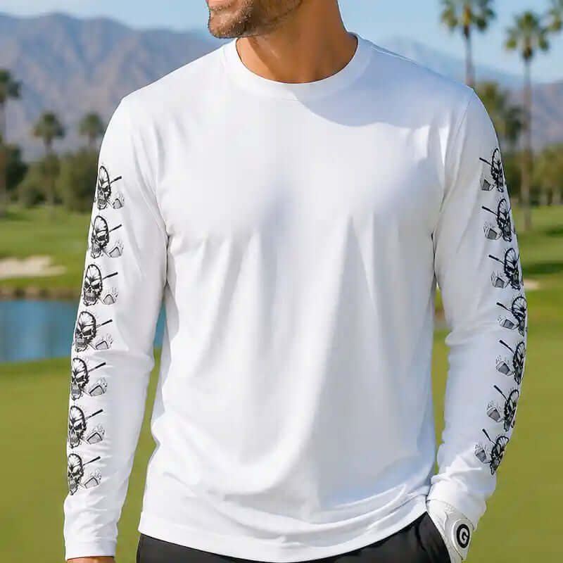 White long-sleeve shirt with black graphic designs on sleeves against a scenic background