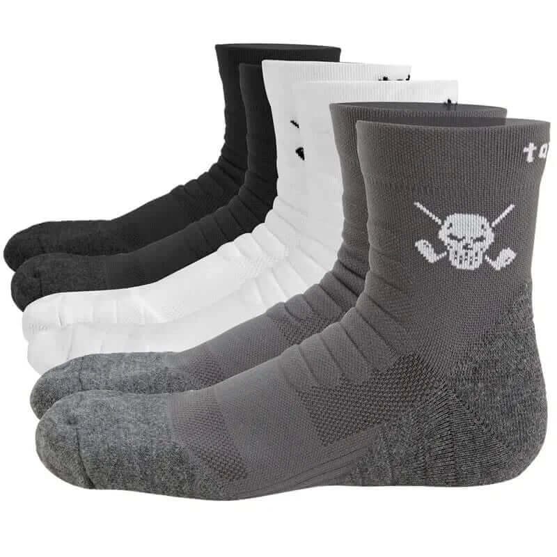 Three pairs of athletic socks with a skull and crossed clubs design on the instep, available in black, white, and gray colors.