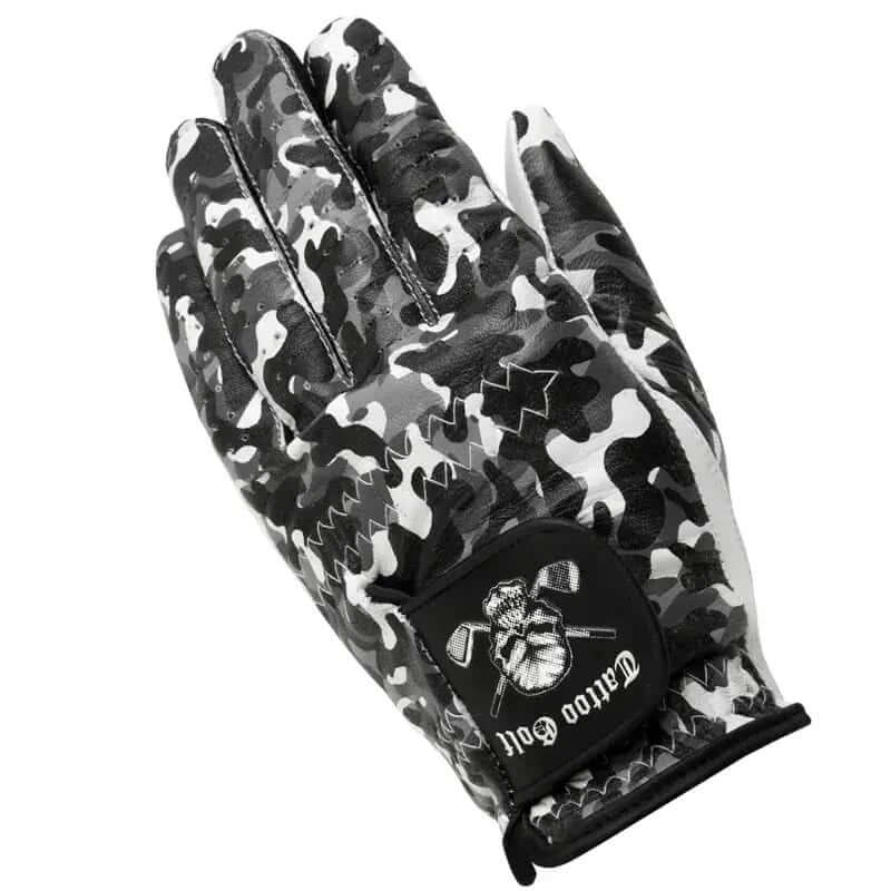 A man's hand wearing a white, black, and gray camouflage patterned golf glove with a visible logo on the back.