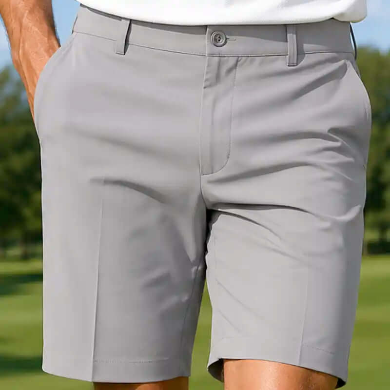 men's gray golf shorts worn by a person on a grassy background