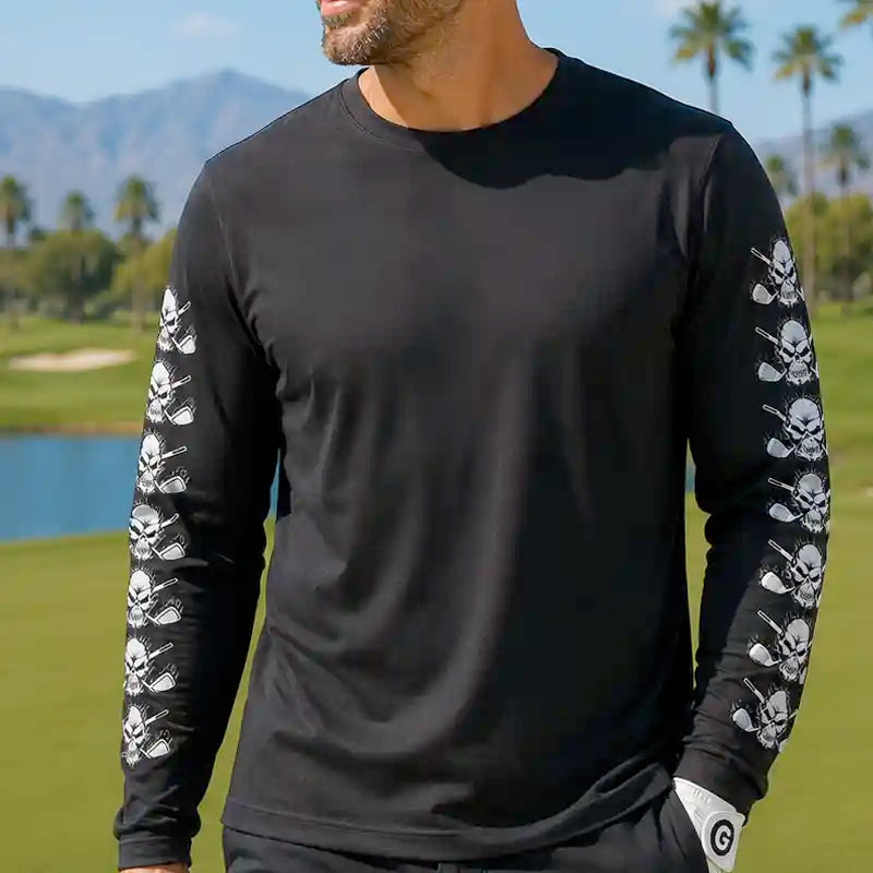 golfer wearing a black long-sleeve shirt with skull designs on sleeves