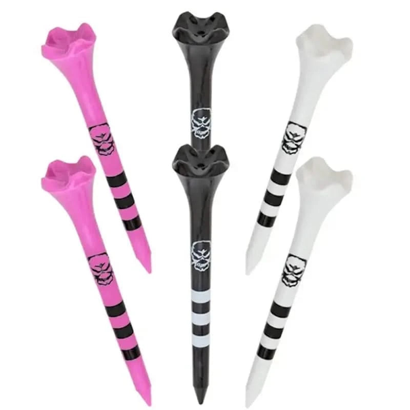 A set of Tattoo Performance Golf Tees in various colors, including black, white, pink, and a mix of colors. Each tee has a skull and crossbones design near the top.