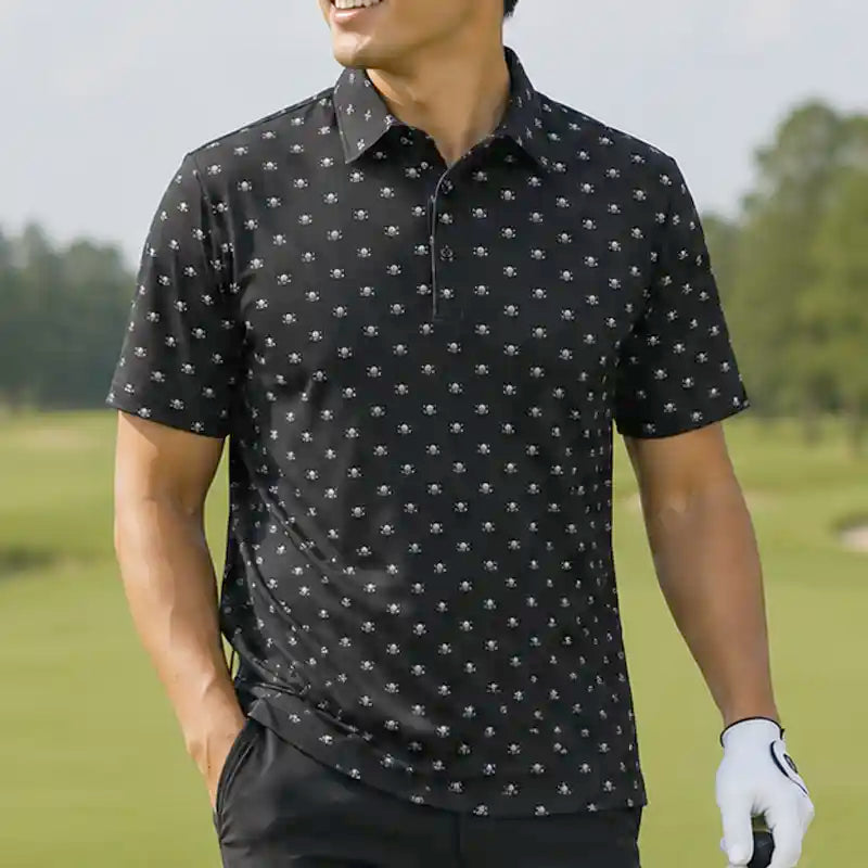 Man wearing a black skull patterned polo shirt on a golf course