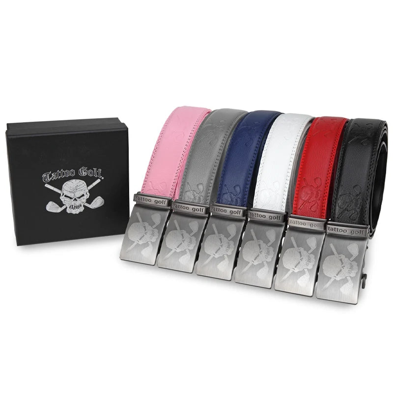 A collection of Tattoo Golf leather ratchet belts displayed in a row, with buckles down and a skull and crossbones design on the front. The belts are in various colors including pink, blue, white, black, and red.