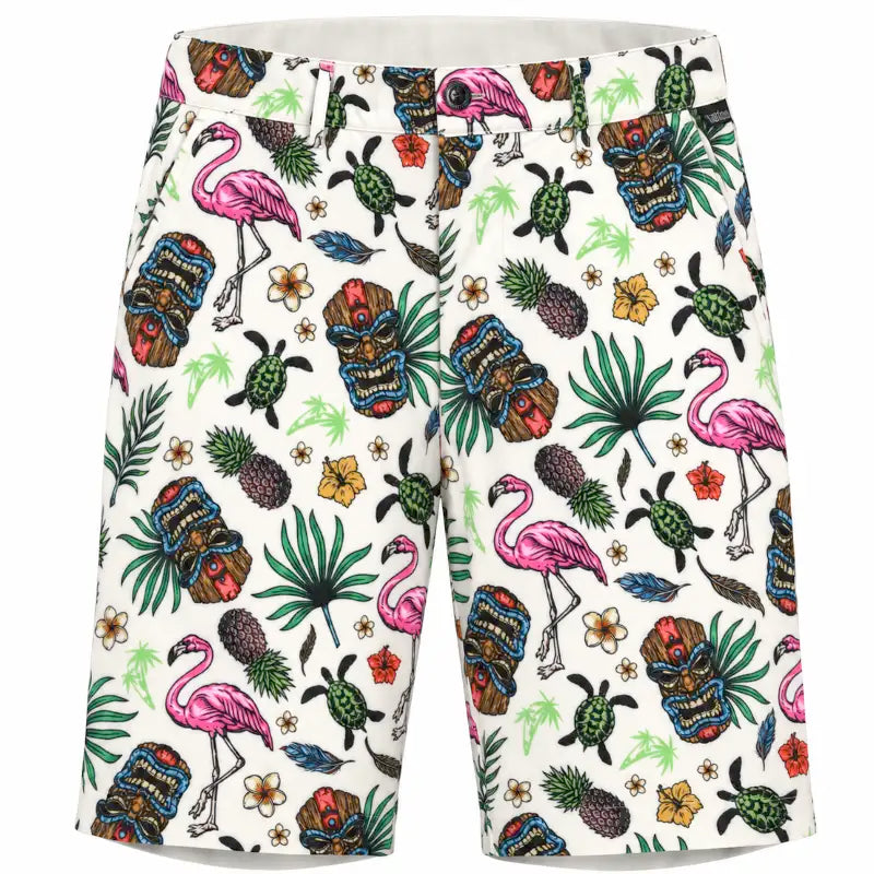 Front view of white Tiki golf shorts with colorful tiki masks, pink flamingos, green turtles, pineapples and tropical foliage.