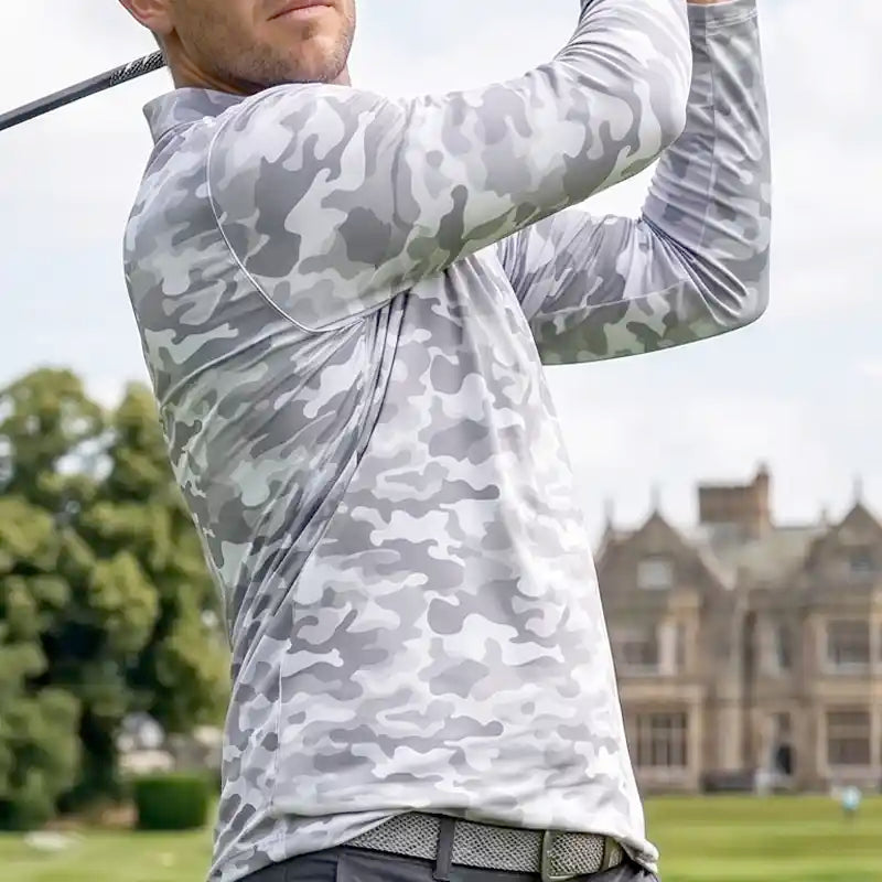 golfer wearing a white camouflage long-sleeve shirt on a golf course