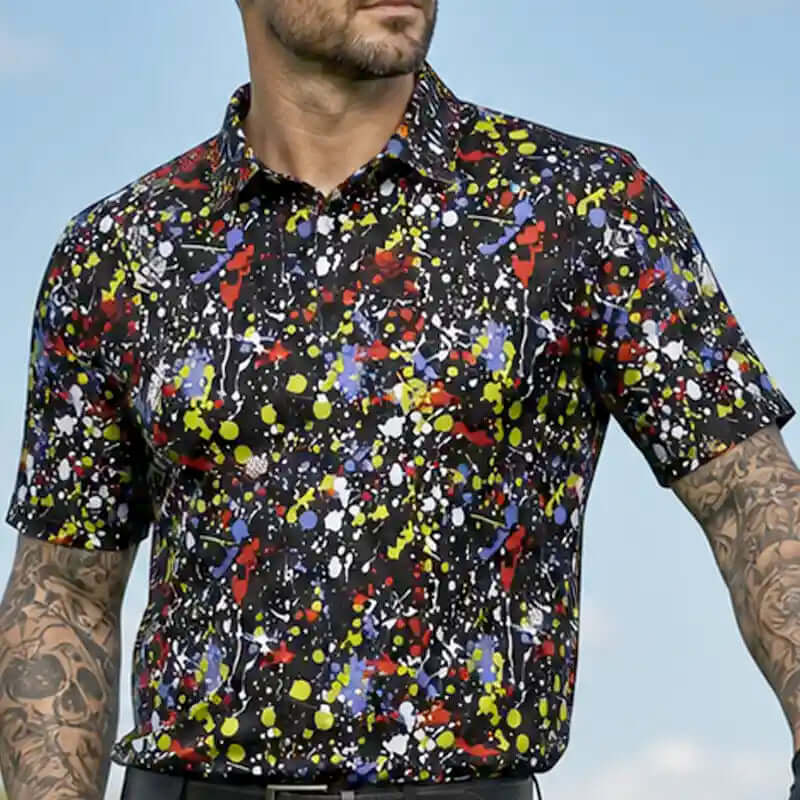 golfer wearing a game black colorful abstract patterned golf shirt