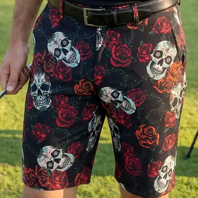 men's Golf Shorts with skull and rose pattern worn by a person on a golf course
