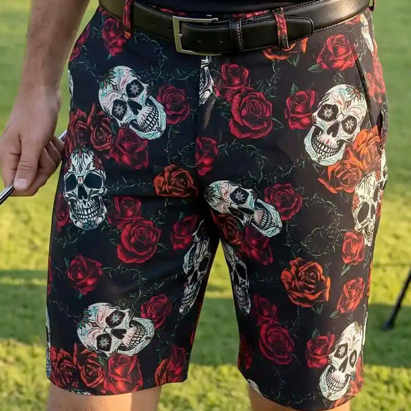 men's Golf Shorts with skull and rose pattern worn by a person on a golf course