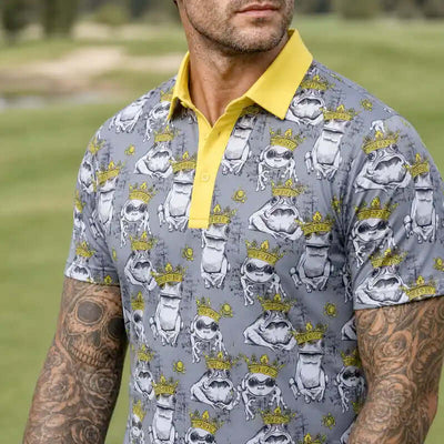 Man wearing a frog patterned polo shirt with a yellow collar 