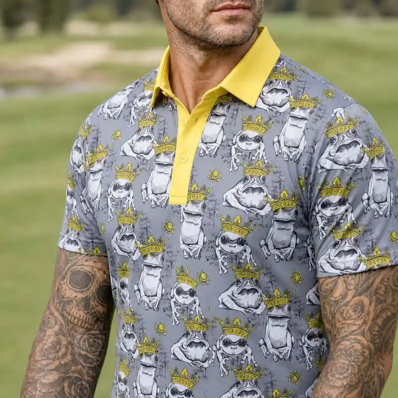 Man wearing a frog patterned polo shirt with a yellow collar 