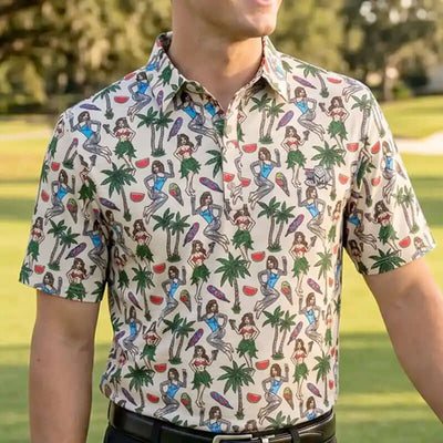 Person wearing a hula patterned golf shirt with palm trees and people in a tropical setting.