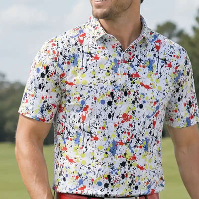 golfer wearing a colorful splatter-patterned shirt on a golf course