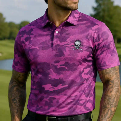 golfer wearing a purple camouflage golf polo shirt with a skull design on a golf course.