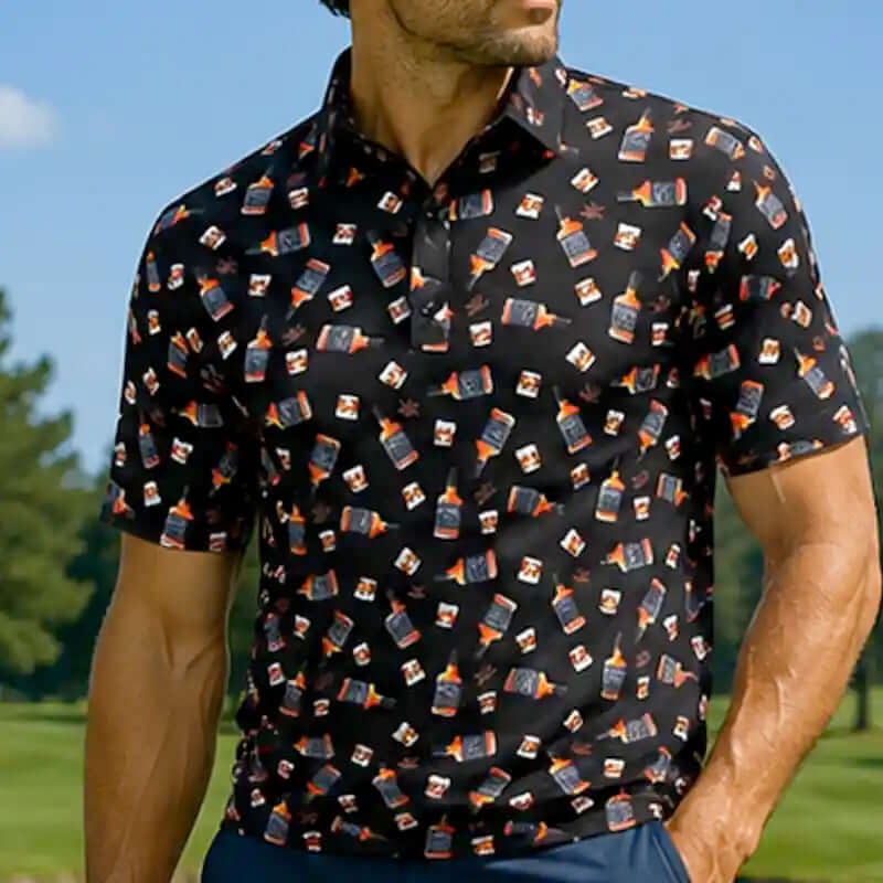 Man wearing a black whiskey patterned shirt on a golf course