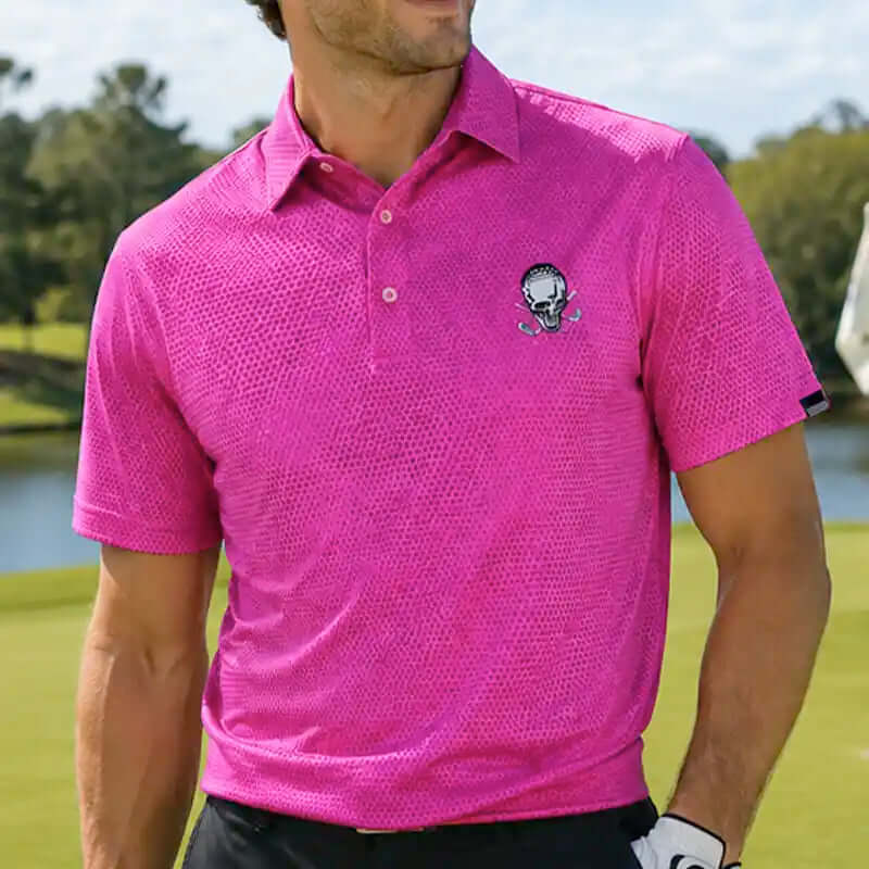 golfer wearing a pink polo shirt with a tattoo logo on a golf course