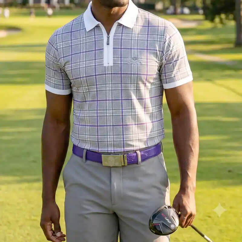 Man in plaid shirt and gray pants holding a golf club on a golf course