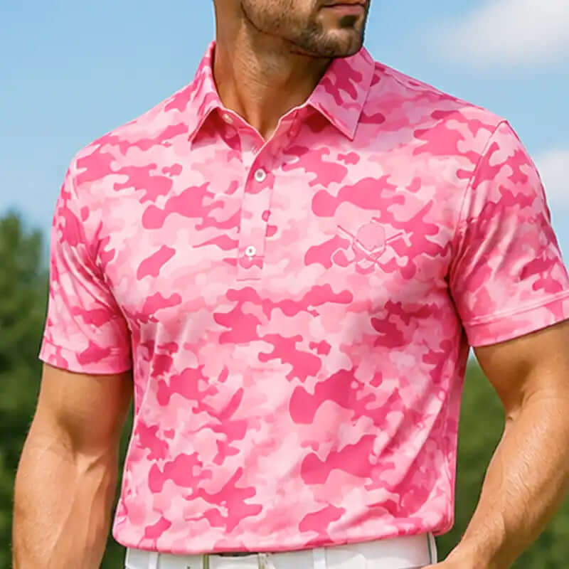 golfer wearing a pink camouflage polo shirt with a blurred background