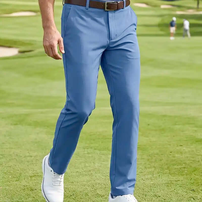 golfer wearing blue golf pants on a golf course. Best men's golf pants