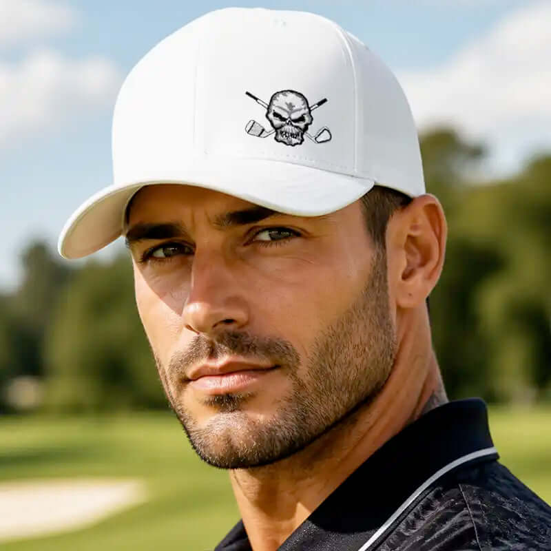 A golfer wearing a white delta baseball hat with a black skull and crossed golf clubs logo