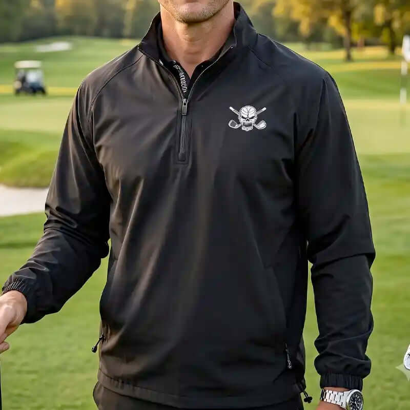 golfer with black golf jacket with skull logo on left chest 