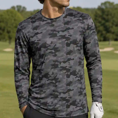 golfer wearing a black camouflage long-sleeve shirt on a golf course