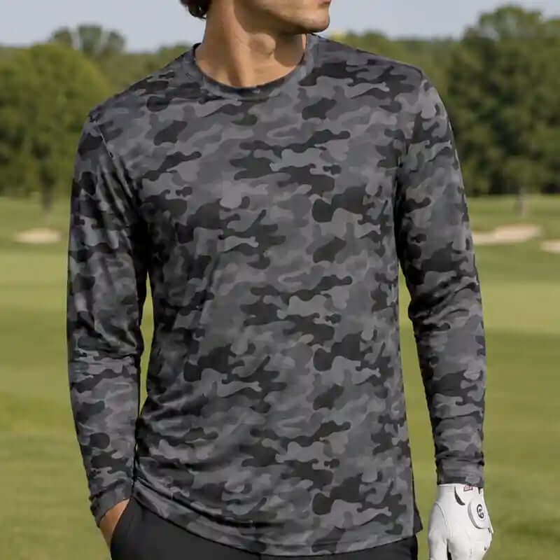 golfer wearing a black camouflage long-sleeve shirt on a golf course