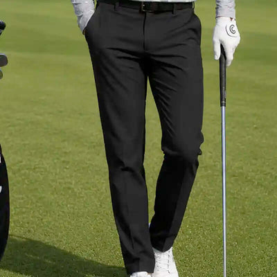 man wearing black golf pants, best golf pants for men