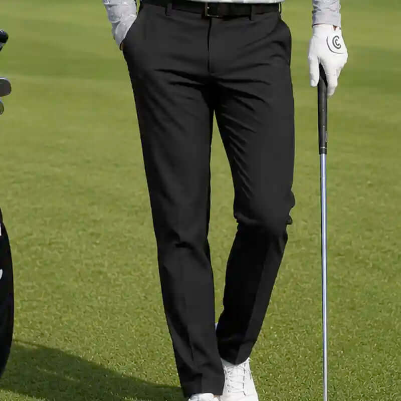 man wearing black golf pants, best golf pants for men