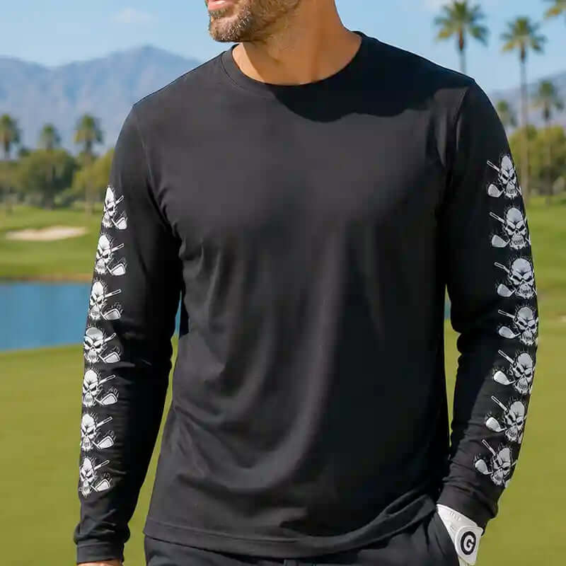 golfer wearing a black long-sleeve shirt with skull designs on sleeves