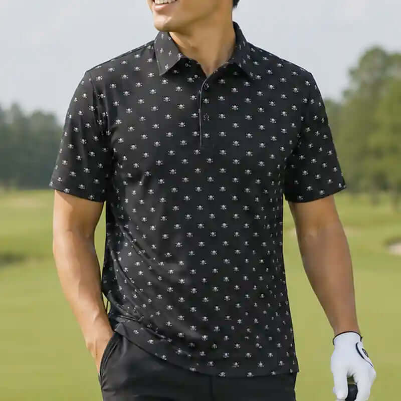 Man wearing a black skull patterned polo shirt on a golf course
