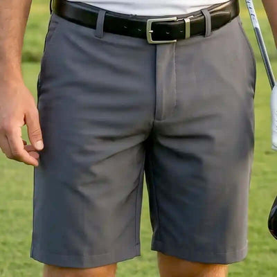 charcoal golf shorts for men worn by a person on a golf course