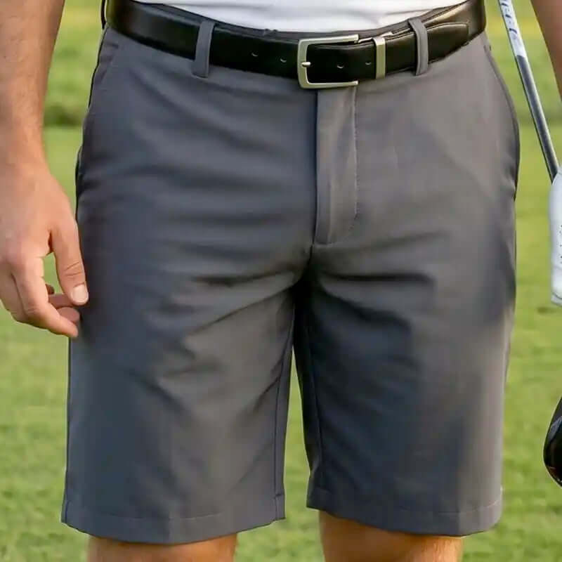 charcoal golf shorts for men worn by a person on a golf course