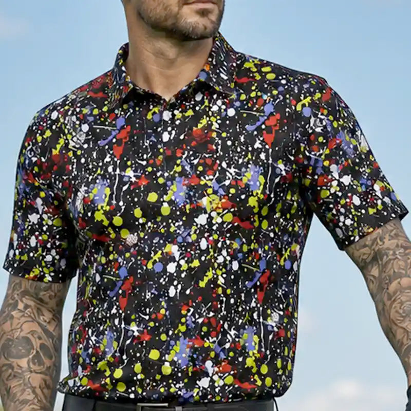 golfer wearing a game black colorful abstract patterned golf shirt