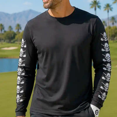 golfer wearing a black long-sleeve shirt with skull designs on sleeves