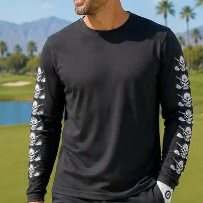 golfer wearing a black long-sleeve shirt with skull designs on sleeves