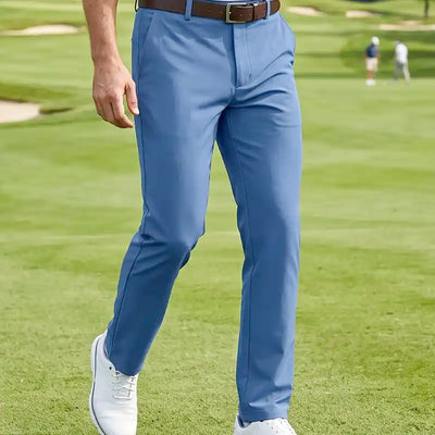 golfer wearing blue golf pants on a golf course