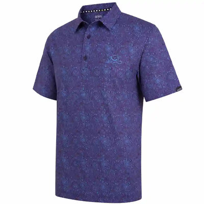 A golf polo shirt in a deep purple color with an all-over blue circular and floral pattern, featuring a two-button placket and a small skull logo on the left chest.