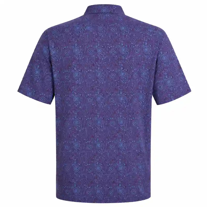A purple golf polo shirt shown from the back, featuring an all-over blue and purple circular paisley pattern on a purple base.